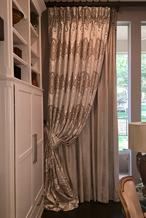 Custom drapes over dining room windwo